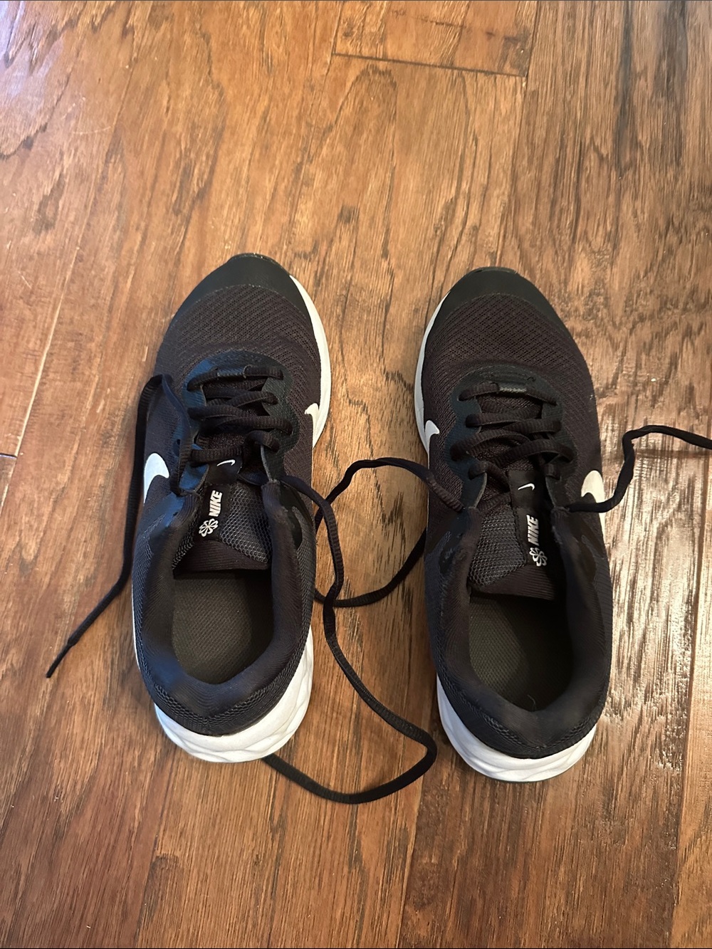 Nike Child Black Running Shoes with White Swoosh